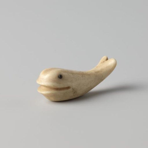 Figure in the shape of a dolphin
