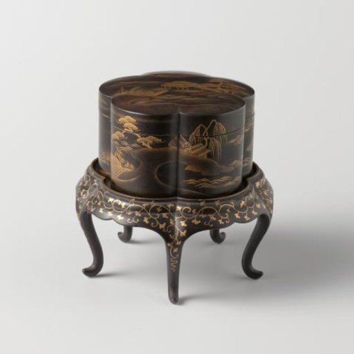 Foot, with gilded landscapes on a black ground