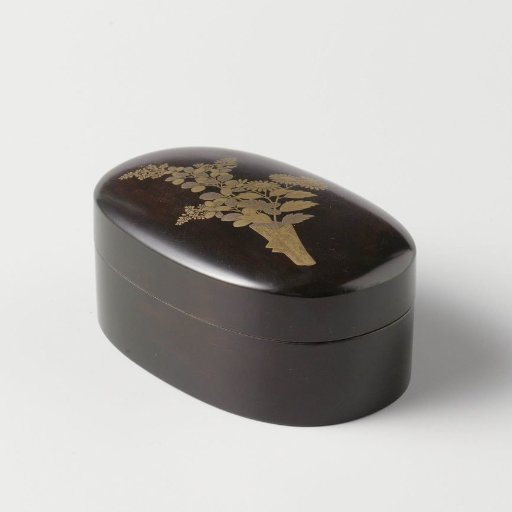 Oval box, black lacquer with a branch of flowers in makie