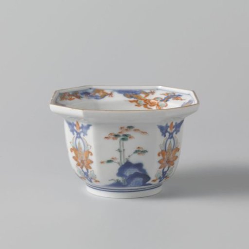 Octagonal bowl with flowering plants near a rock and floral scrolls
