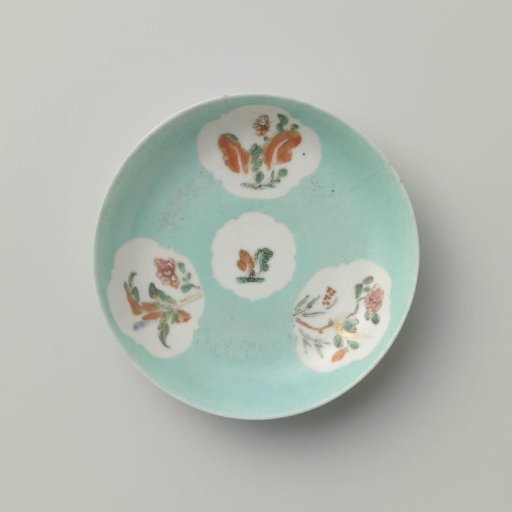 Saucer with flowering plants in shaped panels