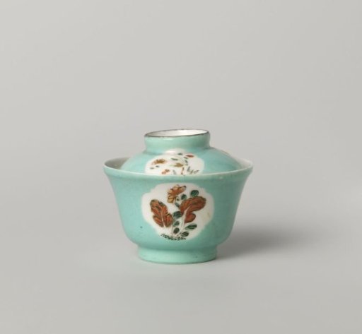 Bell-shaped covered cup with flowering plants in shaped panels