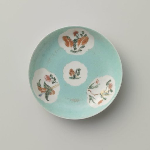 Saucer with flowering plants in shaped panels