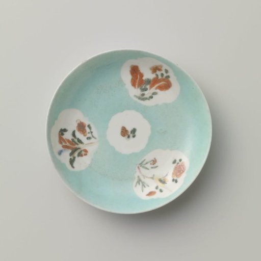 Saucer with flowering plants in shaped panels