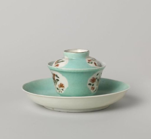 Bell-shaped covered cup and saucer with flowering plants in shaped panels