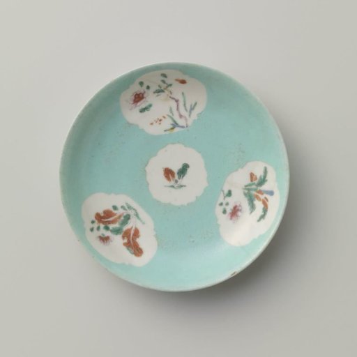 Saucer with flowering plants in shaped panels