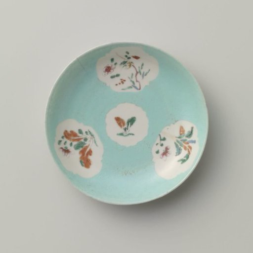 Saucer with flowering plants in shaped panels