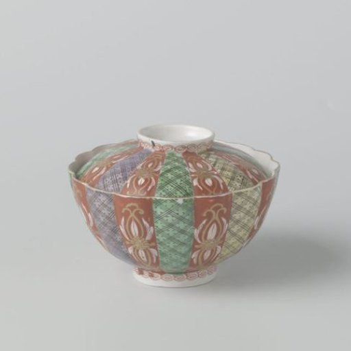 Covered bowl with scrolls, diaper pattern and scattered flowers