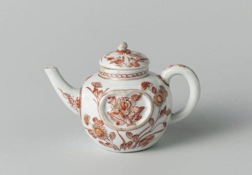 Tea pot with flowering plants, a cock and a chicken