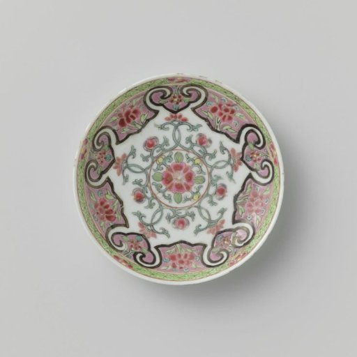 Saucer with floral scrolls in a heavily outlined, shaped panel