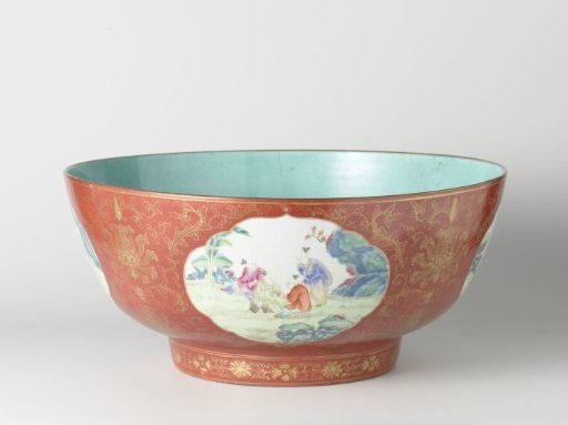 Straigh-sided bowl with playing boys in shaped panels on a red ground with floral scrolls