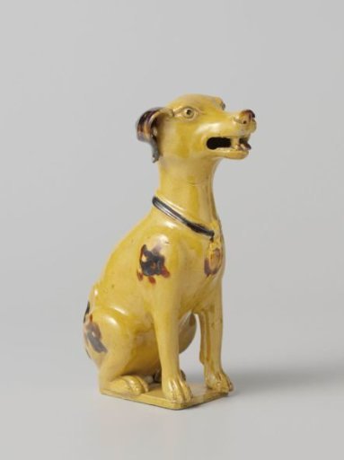 Figure of a seated dog with spots and collar
