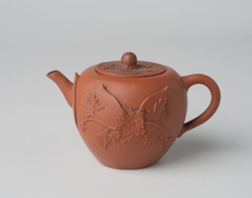 Teapot with a flower spray in relief