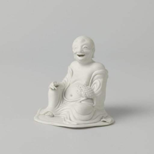 Figure of a seated Liu Hai with his toad