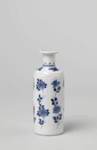 Small cilindrical vase with flower sprays in moulded panels and precious objects