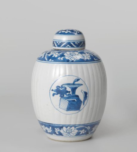 Ovoid fluted covered jar with precious objects in medallions and floral scrolls