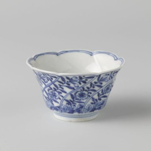 Cup with moulded, twisted panels with flower sprays
