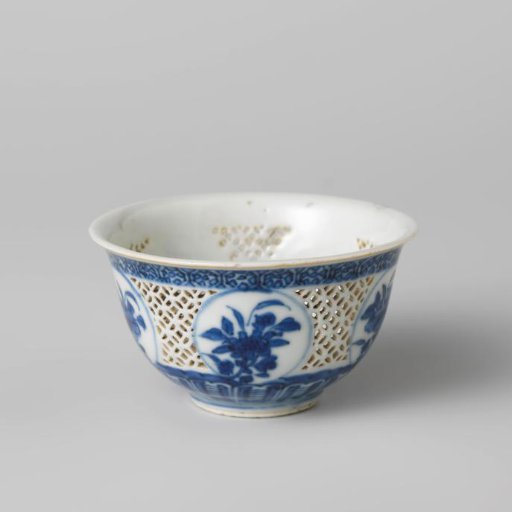 Bell-shaped bowl with pierced sides and flower sprays in medallions