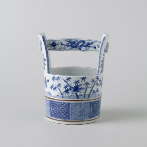 Bucket-shaped flowerpot with flowering plants, birds, dragons and diaper patterns