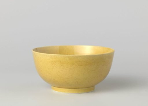 Bowl with pearl chasing dragons above swirling waves