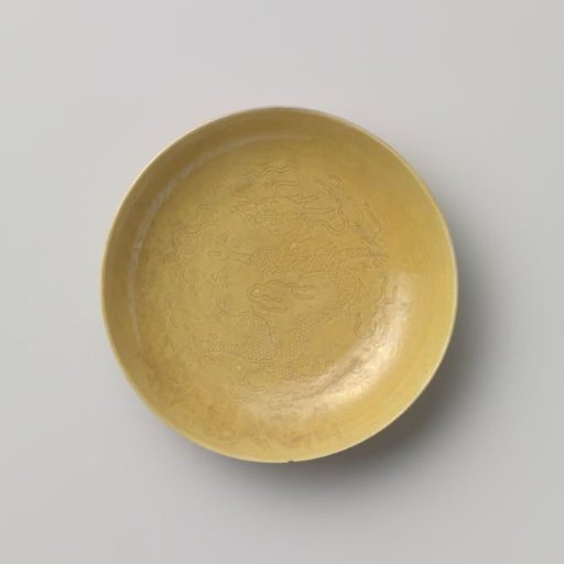Saucer-dish with incised pearl chasing dragon between flames