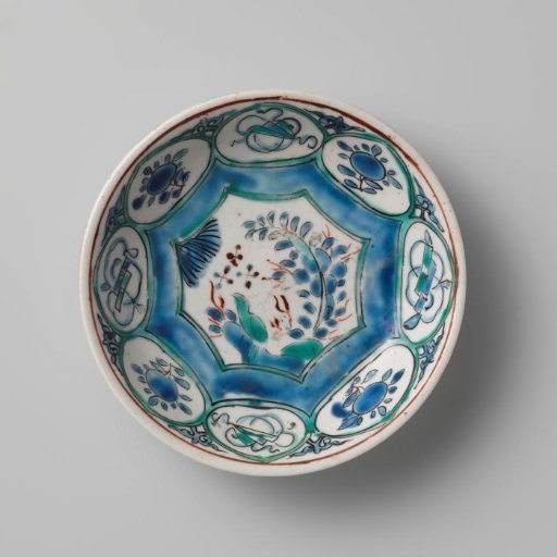 Saucer-dish with a bird on a rock, flower sprays and auspicious objects