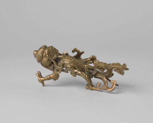 Handle of yellow copper from a pilgrim's vase
