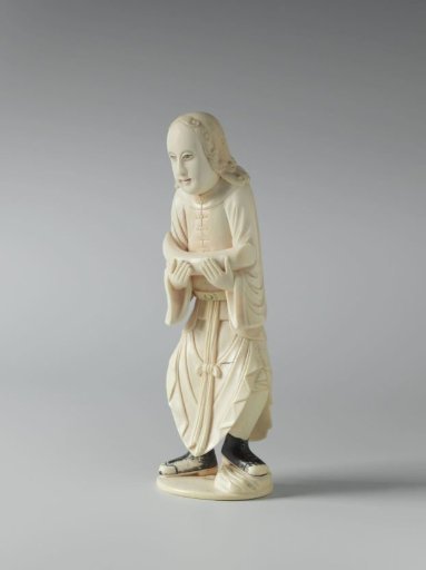 European figure with an elephant's tusk in tribute