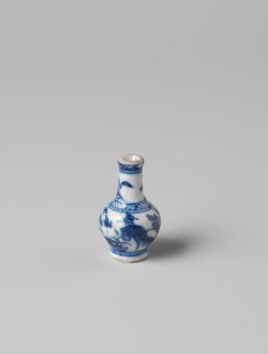 Miniature bottle vase with flowering plants