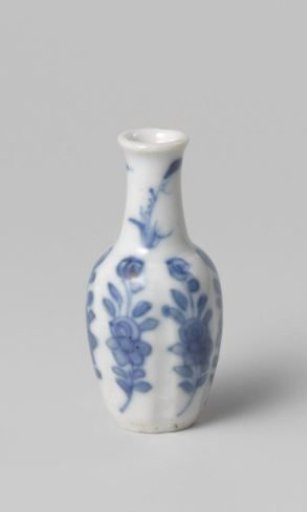 Miniature bottle vase with flowering plants