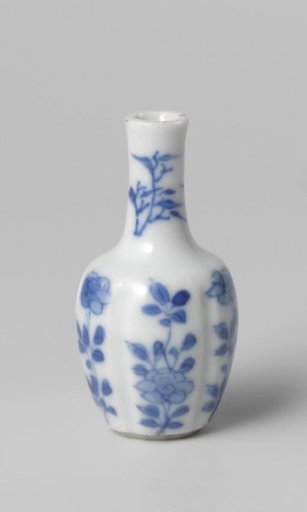 Miniature bottle vase with flowering plants