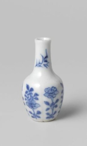 Miniature bottle vase with flowering plants