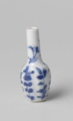 Miniature bottle vase with flowering plants