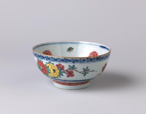 Bowl with incised floral scrolls and a bird on a flowering plant
