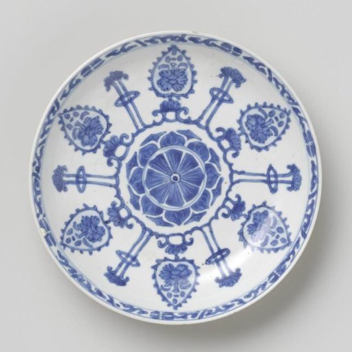 Saucer-dish with light brown, leaf-shaped panels and lotus flowers