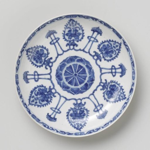 Saucer-dish with light brown, leaf-shaped panels and lotus flowers
