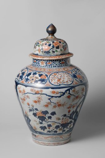 Covered jar with flowering plants in panels, flower sprays and scrolls