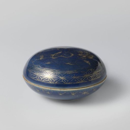 Round box with powder blue, rocks and flowering plants