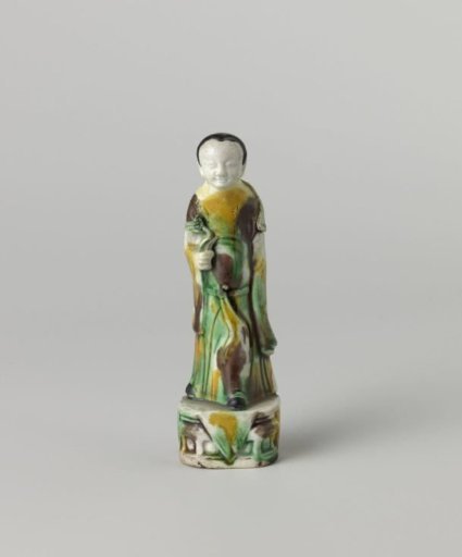 Figure of a woman holding a flower