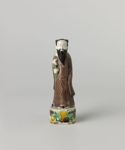 Figure of a bearded man holding a flower
