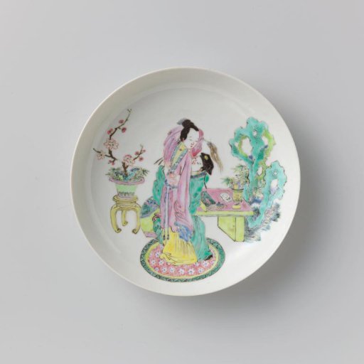 Saucer-dish with a courting couple beside a table, rock and flower pot