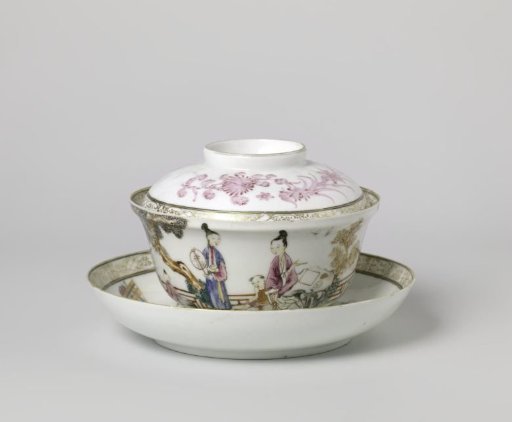Covered cup and saucer with two women and three boys in a fenced garden