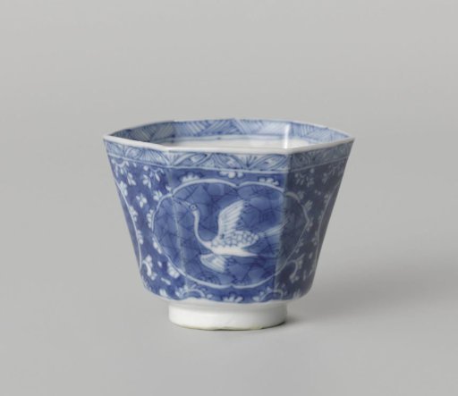 Hexagonal cup with a flying crane in a panel