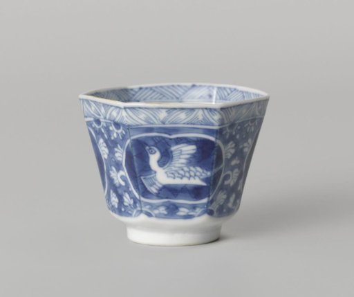 Hexagonal cup with a flying crane in a panel