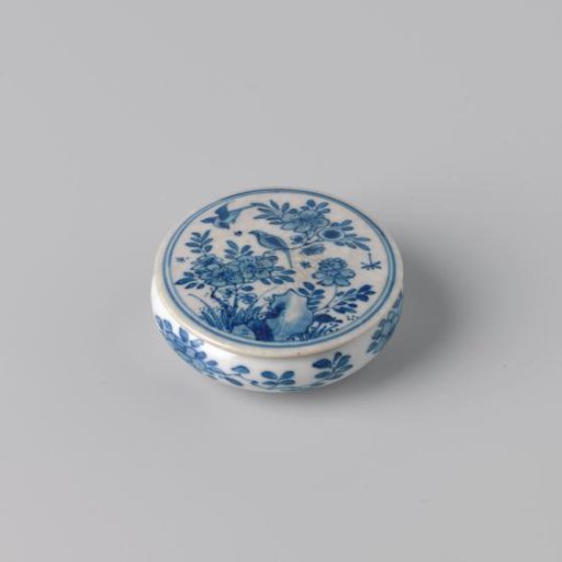 Round box with flowering plants, flower sprays and an erotic scene