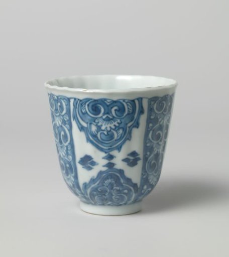 Cup with scalloped rim and panel decoration with large lappets