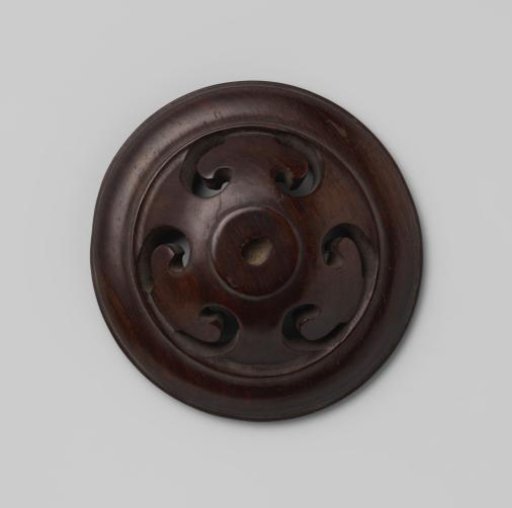 Pierced wooden cover