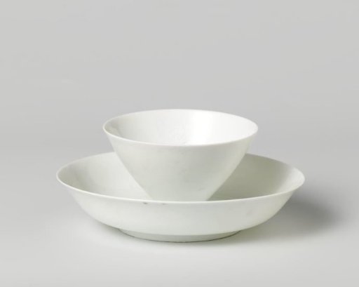Cup and saucer with incised flower heads