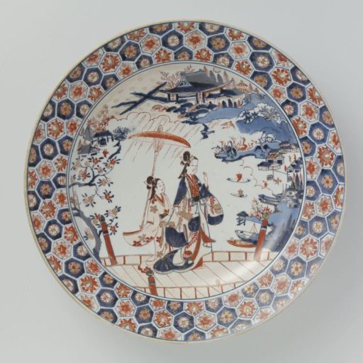 Dish with a woman and attendant on a bridge in a landscape