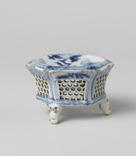 Hexagonal salt cellar with two cocks near flowering plants and pierced sides